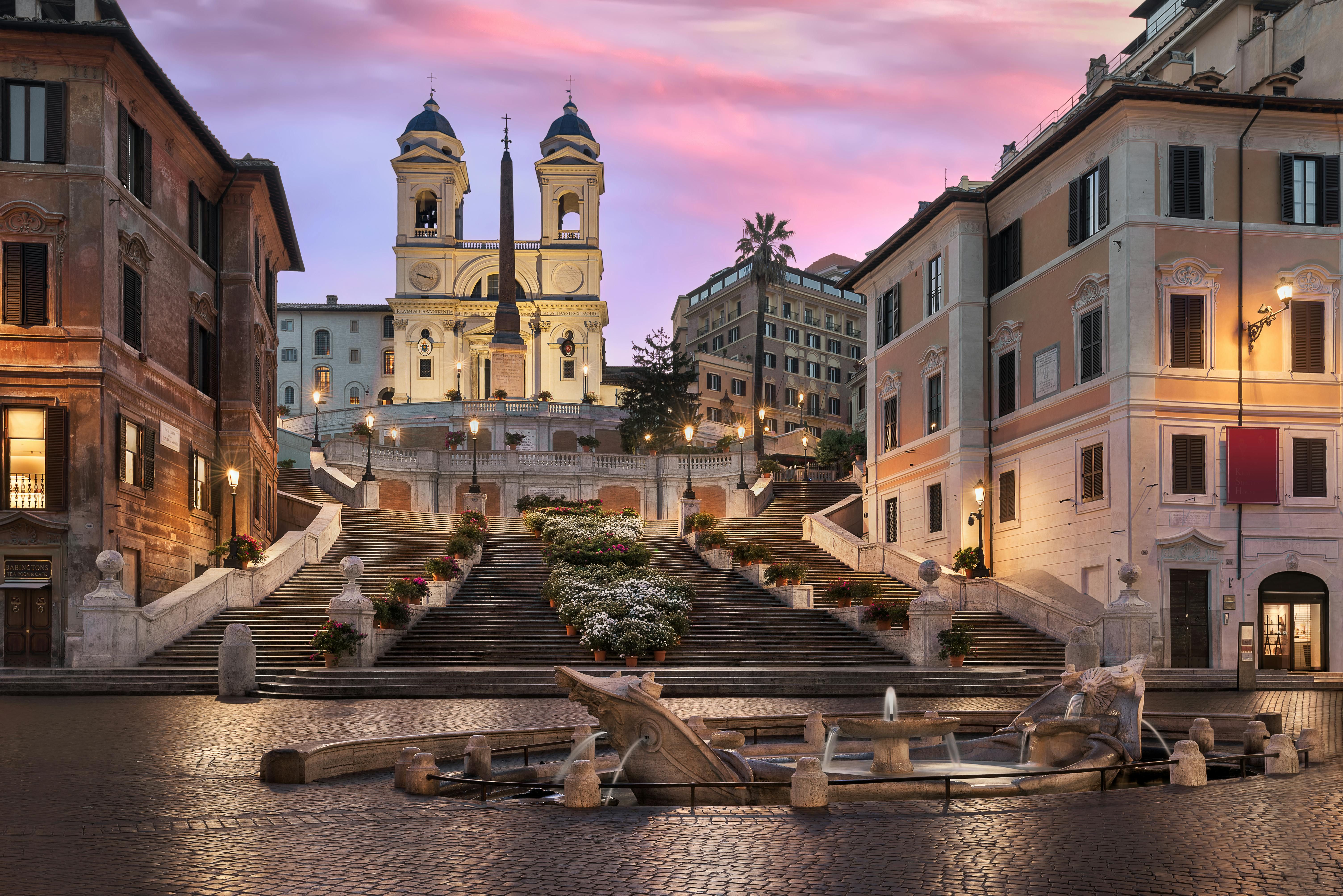 Cobblestoned piazza in Rome at sunset — the atmosphere surrounding Hotel Colle Oppio in Rione Monti
