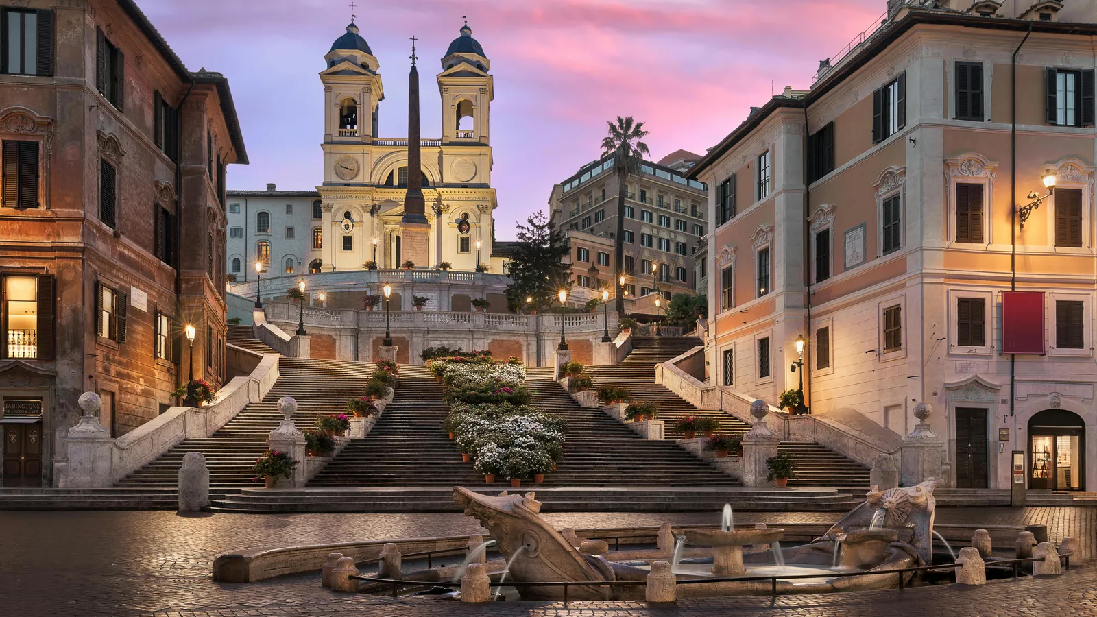 A quiet morning view across the rooftops of Rione Monti, the historic Roman neighbourhood where Hotel Colle Oppio occupies an early-twentieth-century palazzo on Via Panisperna.